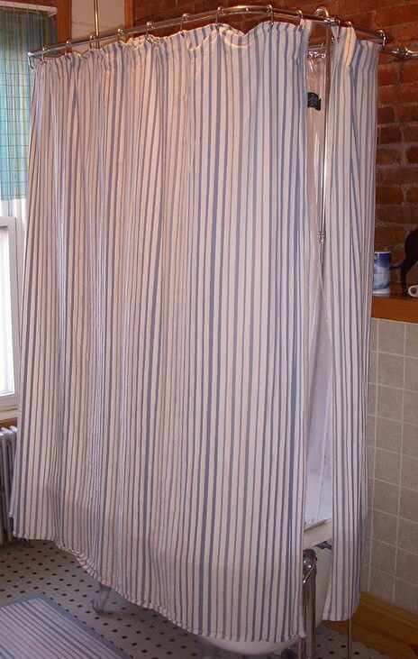 clawfoot tub shower curtain sticks to me